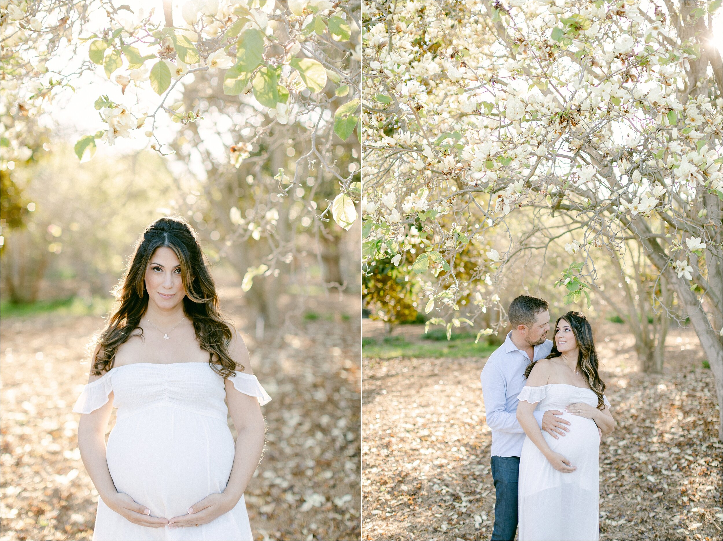 An expectant mother embraces belly while standing under a magnolia tree during floral inspired maternity photos for baby girl
