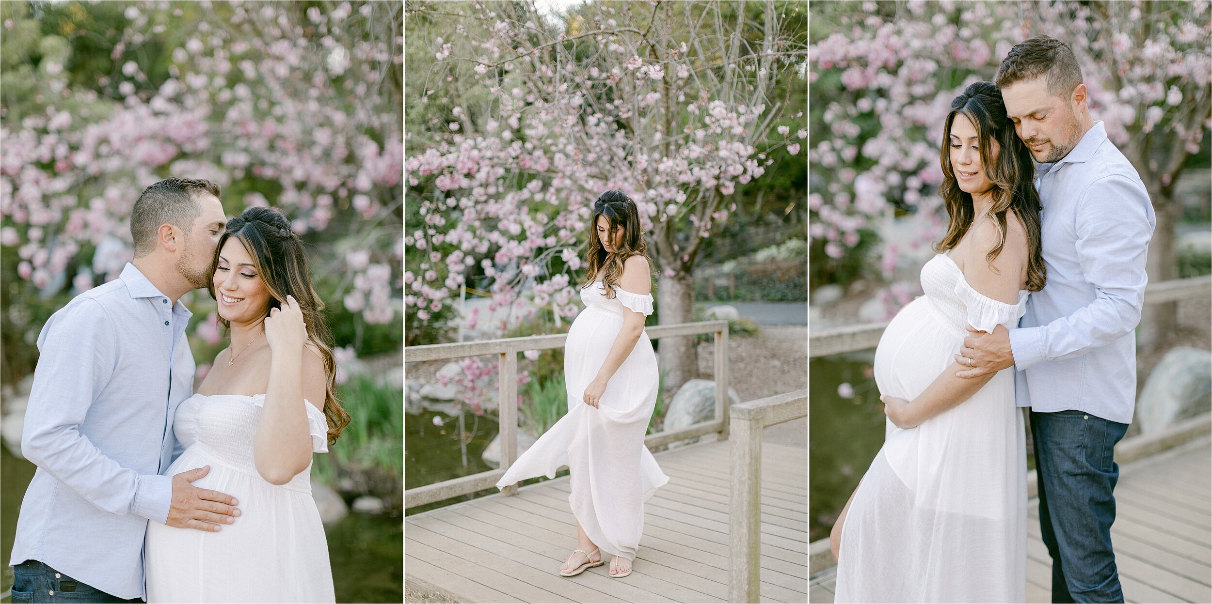Brunette woman in white flowy dress poses with her husband wearing jeans and a pale blue button down while taking their maternity photos in the gardens at the LA Arboretum.