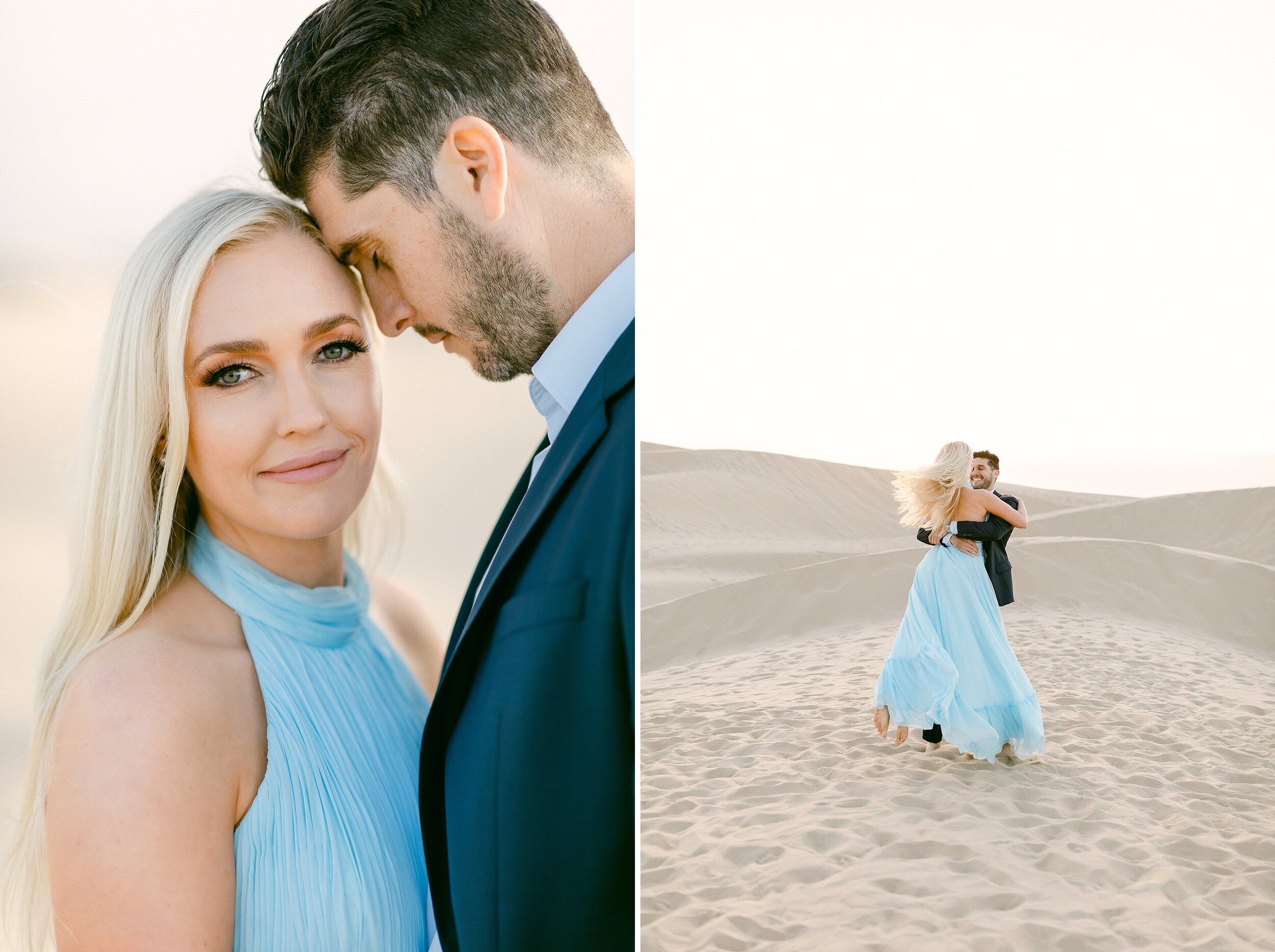 Brunette male in navy blue suite sweeps his blonde fiance in powder blue dress off her feet and spins her around during their sunset sand dunes engagement photos 