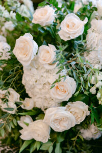 Close up of white floral arrangement.