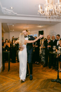 Bride and groom share an elegant first dance.