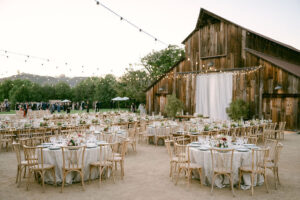 Wide view of the entire reception space featuring the iconic Greengate Ranch Barn as the backdrop.