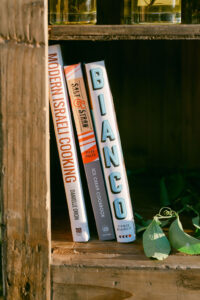 Detail photo showing some of the bride and groom's favorite cookbooks which they used as guest books.