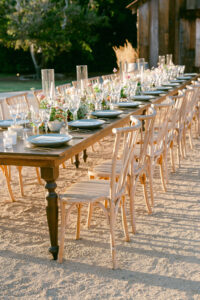 Wide tablescape photo showcasing the long farmhouse style tables.