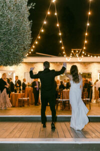 Bride and groom excitedly join their guests at cocktail hour.