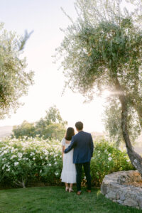 Fiances embrace as the watch the sunset following their engagement at Stonewall Ranch Malibu.