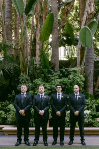 Portrait of groom and his 3 groomsmen prior to his wedding ceremony at the Four Seasons Beverly Hills. Photographed by SoCal wedding photographer Tiffany J Photography.