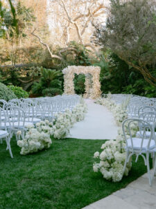 All white wedding ceremony at Swan Lake at Hotel Bel-Air wedding.
