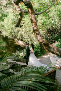 Bride and Groom Portrait by Swan Lake at Hotel Bel Air Wedding